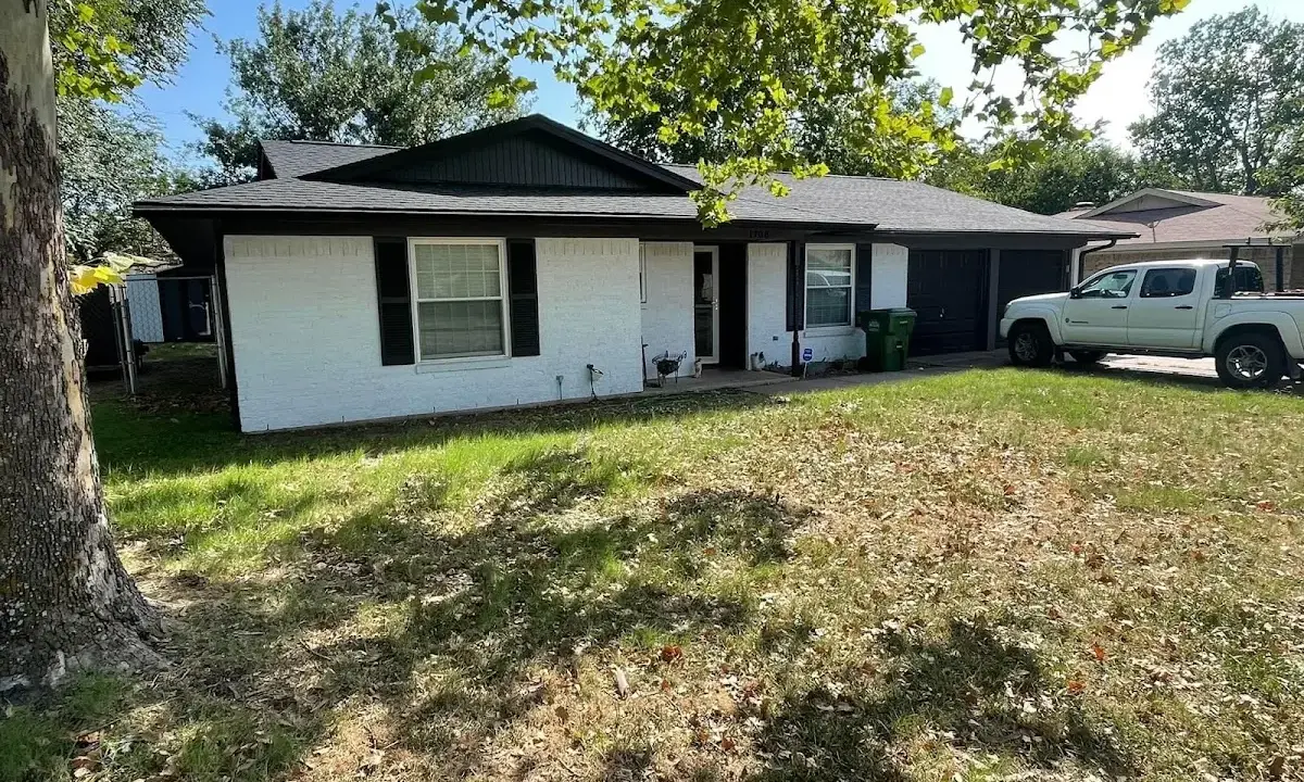 Professional roofing crew working on a residential roof in Dundee